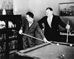 Laurel and Hardy playing pool